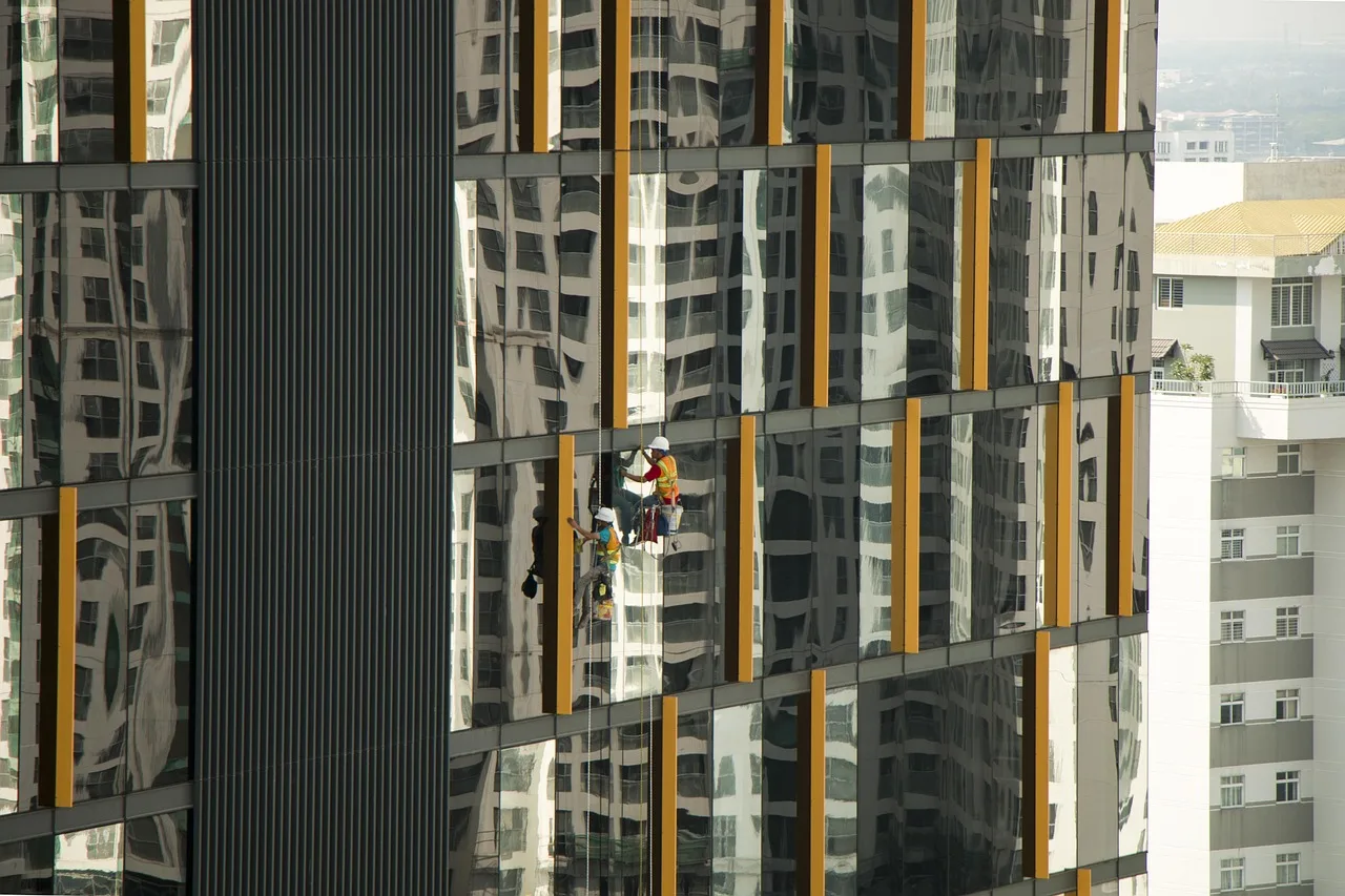 a skyscraper, the building, washing windows, umývač, architecture, the city, vietnam, hochiminh city, window, men. 1 checklist for Canadian crews pressure washing in Buffalo and Detroit